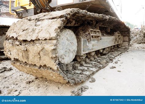 Caterpillar Tractor Of Loader Working Under Construction Stock Photo