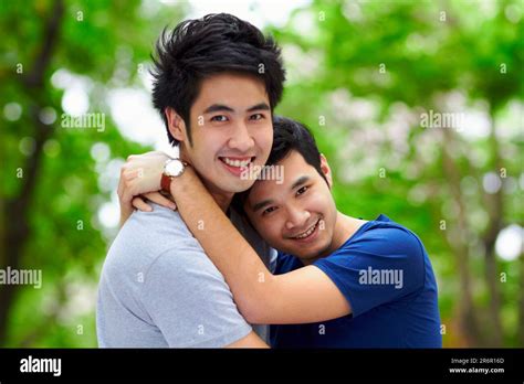 Asian Men Gay Couple And Hug By Trees Portrait And Woods With Love Care And Bonding In Summer