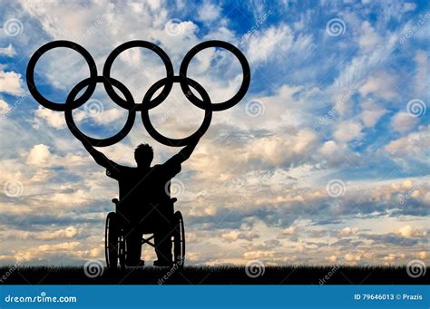 Paralympic Disabled Person In Wheelchair Hold Olympic Rings Editorial