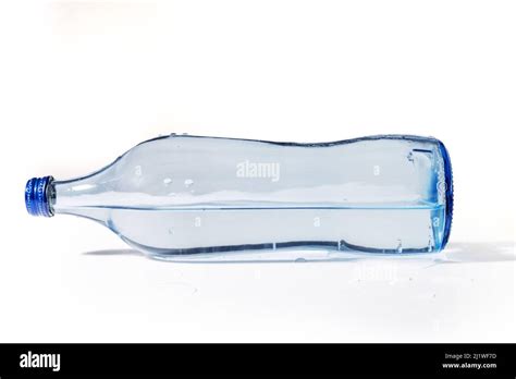 Glass Water Bottle Lying Down And Isolated On White Background Stock