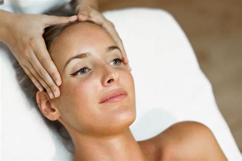 Free Photo Young Woman Receiving A Head Massage In A Spa Center