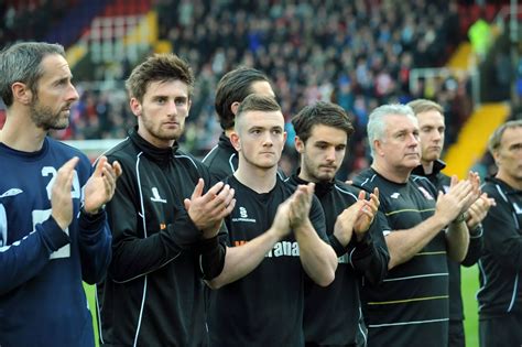 Woking Football Club Holds One Minute Applause In Memory Of Former