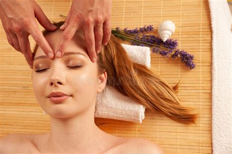 Beautiful Young Woman Having A Face Massage In Spa Salon Wellness