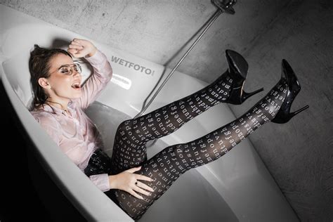 Beautiful Girl In Glasses Takes A Bath In Pantyhose With Inscriptions