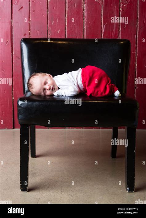 Baby Sleeping On Chair Stock Photo Alamy