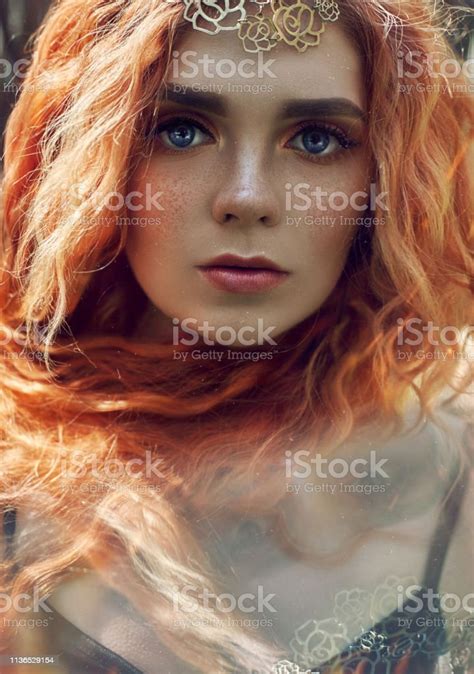 Beautiful Redhead Norwegian Girl With Big Eyes And Freckles On Face In The Forest Portrait Of