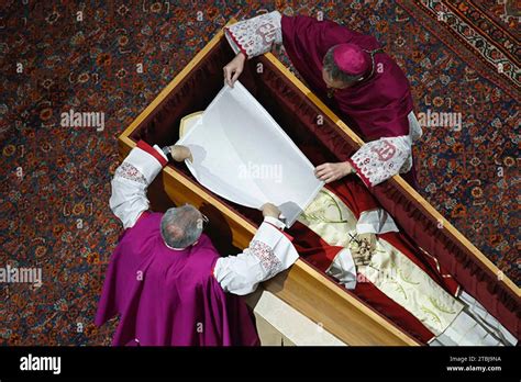 Two Priests Prepare The Coffin Of Pope Emeritus Benedict Xvi For