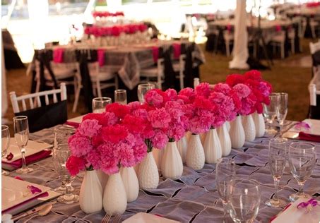 Pink Carnation Centerpieces in White Vases | A Wedding Blog