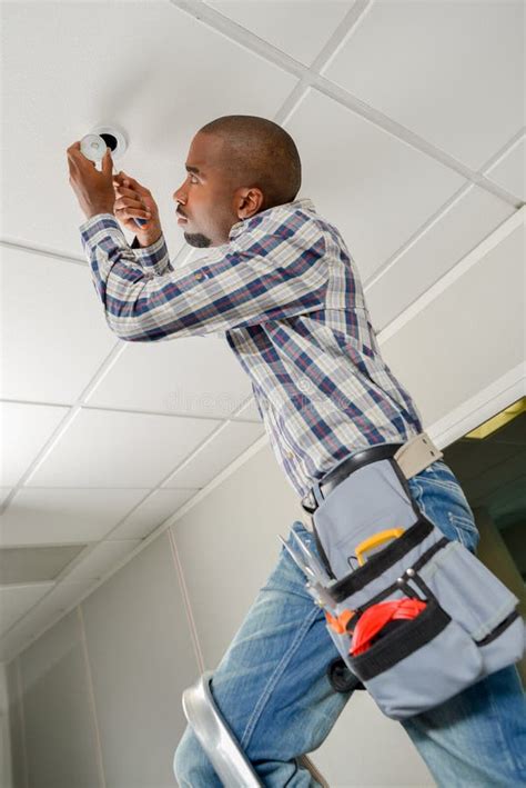 Replacing A Ceiling Bulb Stock Image Image Of Installing 128018407