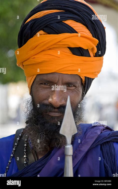 Sikh Man With Lance The Golden Temple Amritsar Punjab India Stock