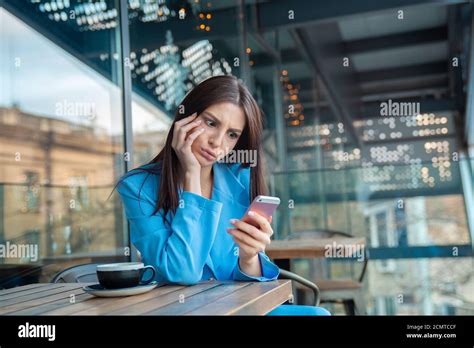 Upset Stressed Shocked Woman Holding Cellphone Frustrated With The