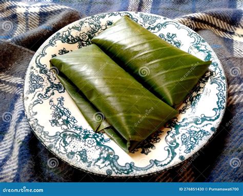 Balinese Specialty Cakes Wrapped In Banana Leaves On The Plate Stock