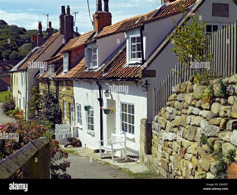 Row of holiday cottages at the seaside village of Sandsend in summer ...