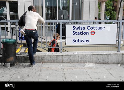 COMMUTERS AT SWISS COTTAGE TUBE STATION IN LONDON UK Stock Photo - Alamy