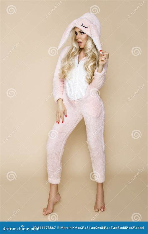 Beautiful Blonde Woman Wearing A Pajama A Bunny Costume Smiling