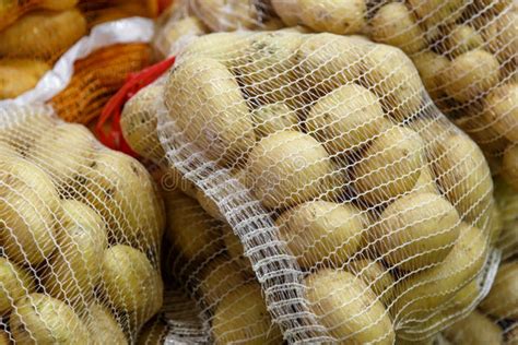 Potatoes in Mesh Bags from a Market Stock Photo - Image of growth ...