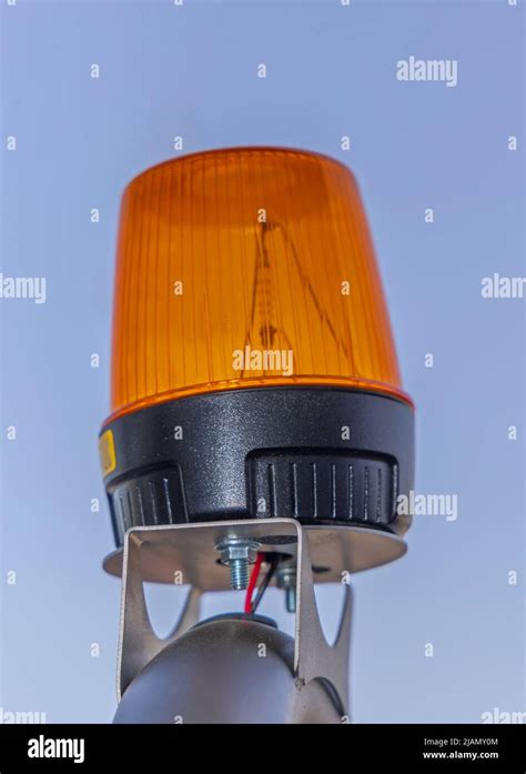 Amber Strobe Signal Light Dome At Construction Vehicle Top Stock Photo
