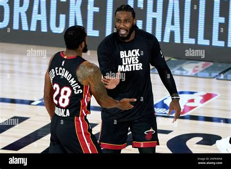 Miami Heat S Andre Iguodala 28 Celebrates With A Teammate During A Break In Play During The