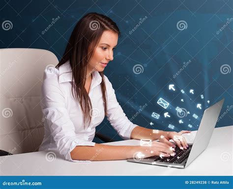 Young Lady Sitting At Dest And Typing On Laptop With Message Icons