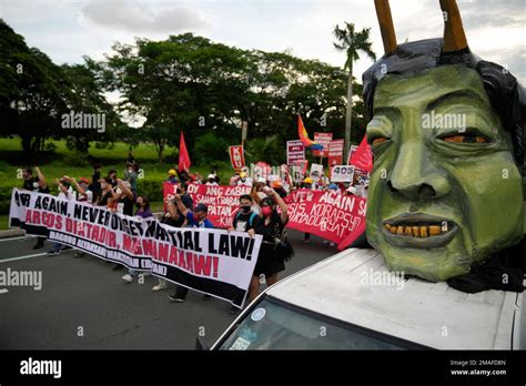 Human Rights Groups Pass By An Effigy Of Philippine President Ferdinand