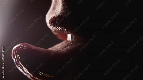 Close Up Of Woman S Mouth She Shows Her Tongue Seductively And Licking