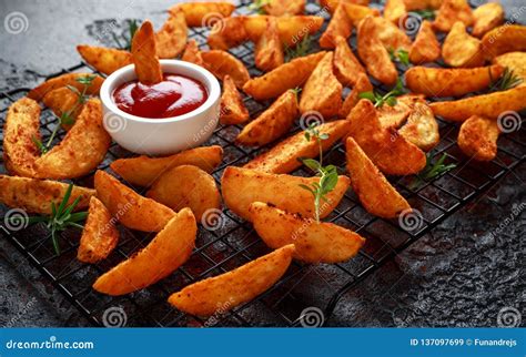 Paprika Potato Wedges Fries Chips With Ketchup And Thyme Stock Image