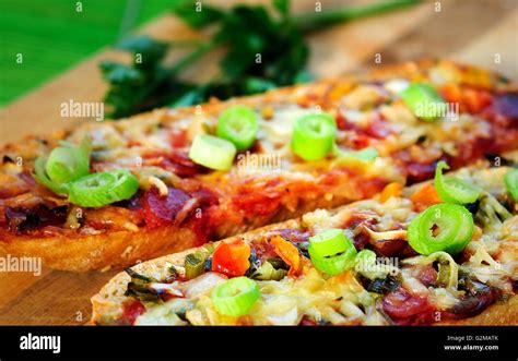 Bruschette With Salami On Table Stock Photo Alamy