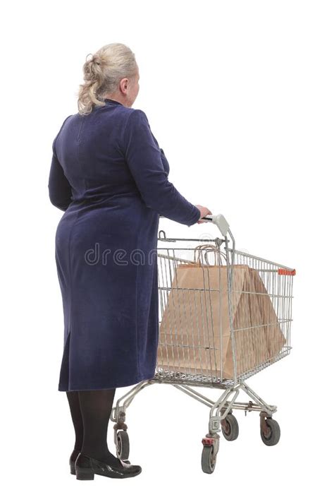 Back View Of Senior Woman Shopping At The Supermarket And Pushing A