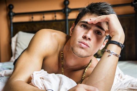 Shirtless Male Model Lying Alone On His Bed Stock Image Image Of