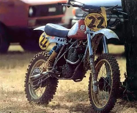 A Dirt Bike Parked Next To A Tree