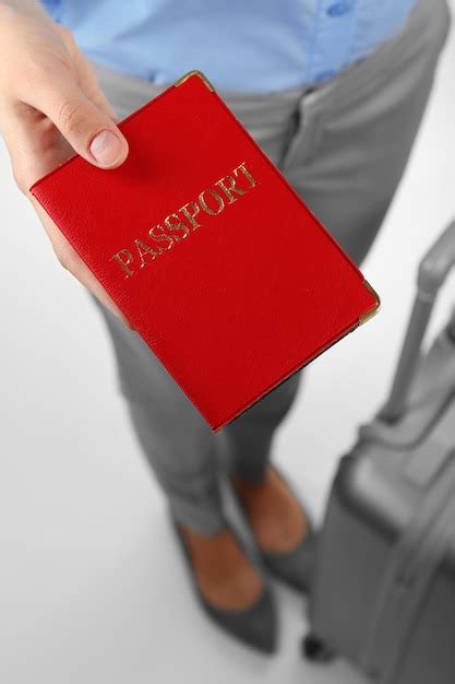 Premium Photo Female Hand Holding Passport Closeup