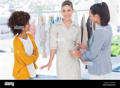 Two Fashion Designers And One Beautiful Model Stock Photo Alamy