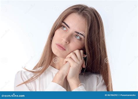 Young Girl Looks Away And Keeps His Hands Face Close Up Stock Photo