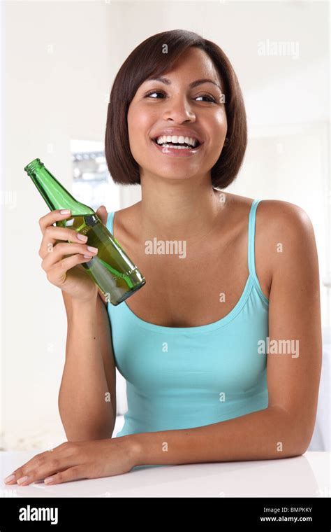 WOMAN HOLDING BOTTLE OF BEER Stock Photo Alamy