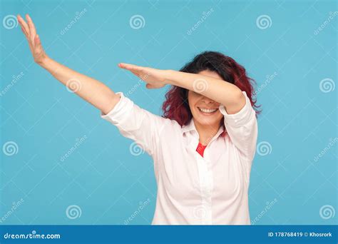 Happy Cheerful Woman In White Shirt Showing Dab Dance Move Celebrating