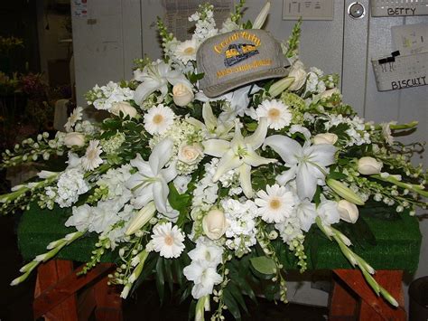 A Casket Spray With White Lilies White Roses White Gerbera Daisies