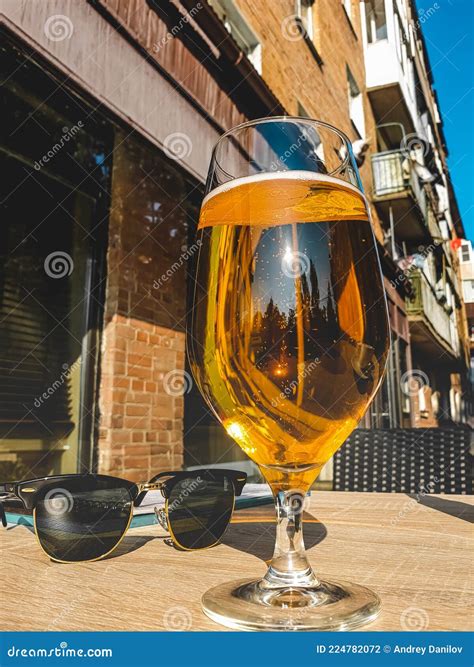 A Glass Of Light Beer And Glasses On A Table In A Cafe A Summer Veranda In A Restaurant Stock