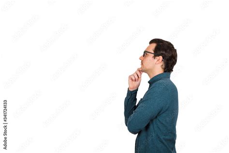 Side View Of Young Businessman Keeps Hand Under Chin Thoughtful