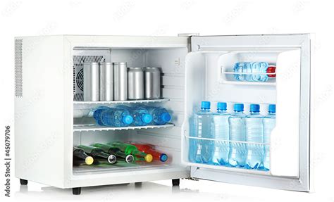 mini fridge full of bottles and jars with various drinks Stock Photo ...