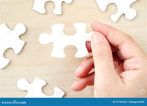 Hand Holding A Piece Of Jigsaw Puzzle Background Stock Photo Image