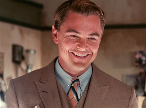 A Man In A Suit Smiling For The Camera