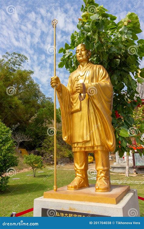 Golden Monk Statue Isolated On White Background Editorial Image