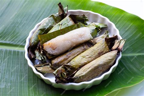 Premium Photo Grilled Sticky Rice In Banana Leaves With Banana Filling