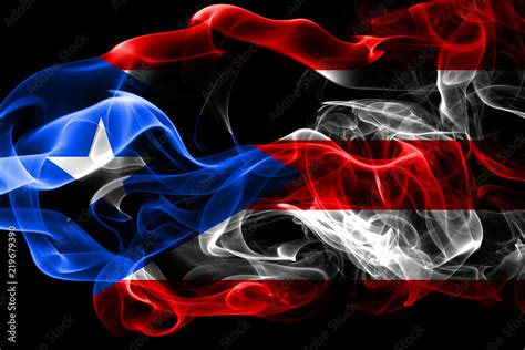 National Flag Of Puerto Rico Made From Colored Smoke Isolated On Black