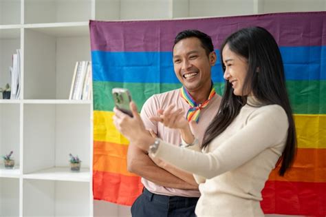 Premium Photo A Happy Asian Gay Man Enjoys Recording A Vlog Or Taking
