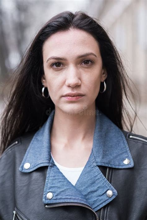 Portrait Of A Beautiful Brunette Girl Who Poses While Walking On The Street Stock Image Image