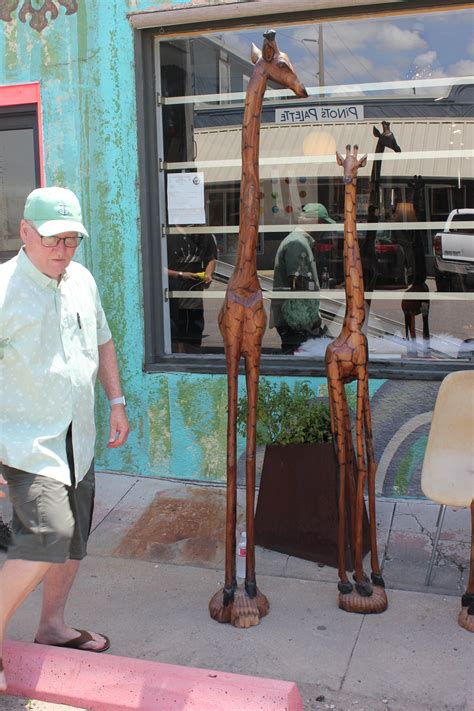 Set Of Four South African Hand Carved Giraffe Sculptures In A Variety