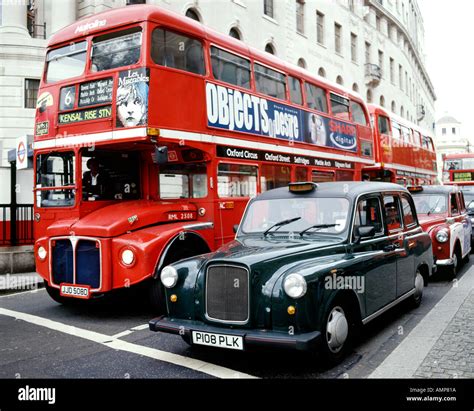 Routemaster Buses And Black Cabs In London Stock Photo Alamy