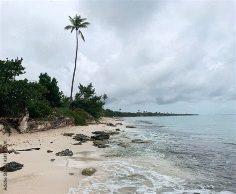 Cloudy day on the beach. Rain on the coast during a beach holiday ...