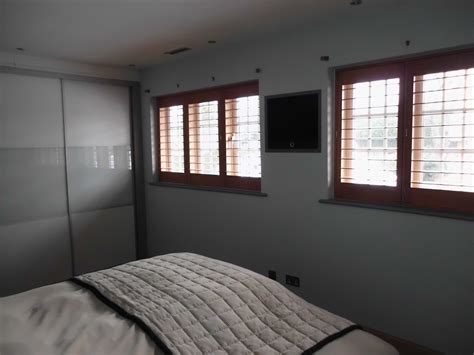 A Pair Of Windows Given The Shutter Uplift Using Golden Oak Stained